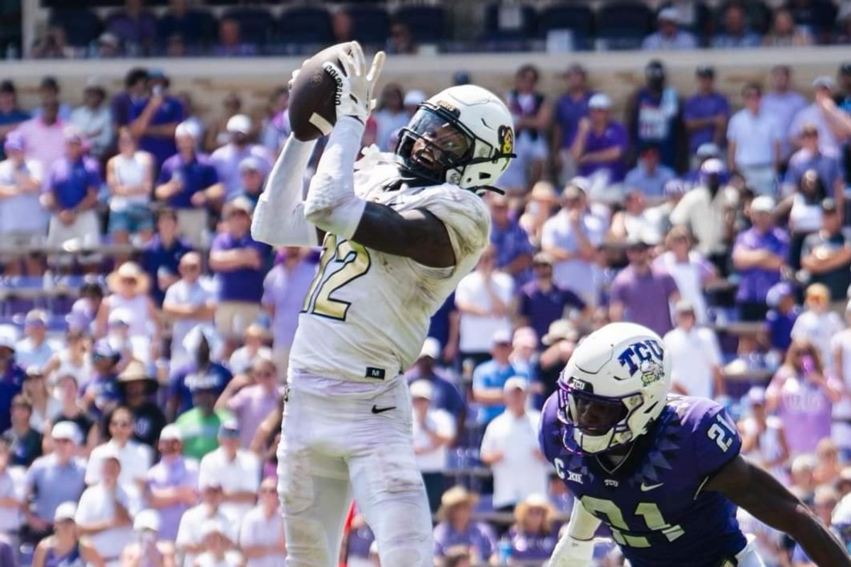 Travis Hunter goes up for a pass vs. TCU